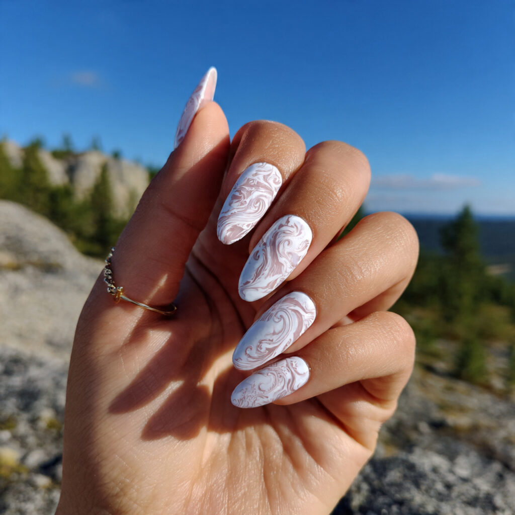 attractive white swirl nails with milky detail wit