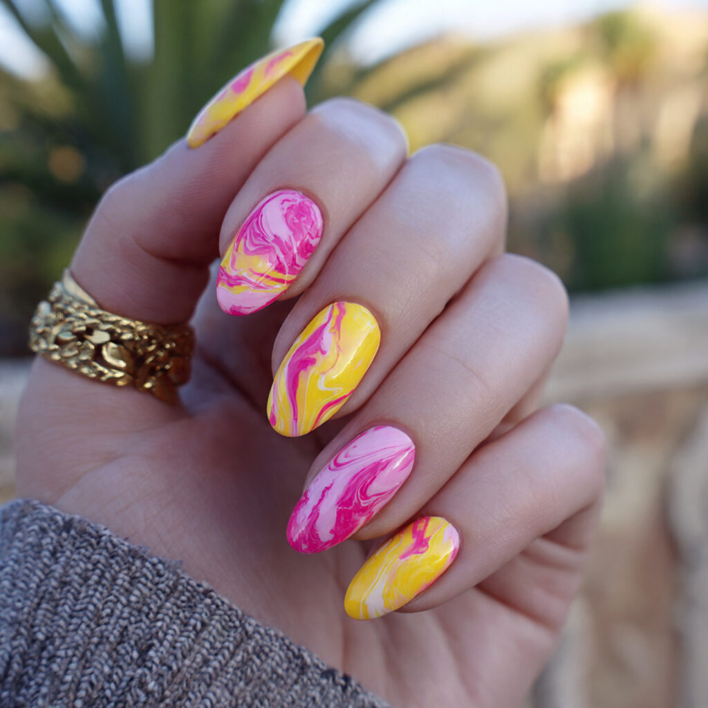 attractive yellow and pink swirl nails with outdoo