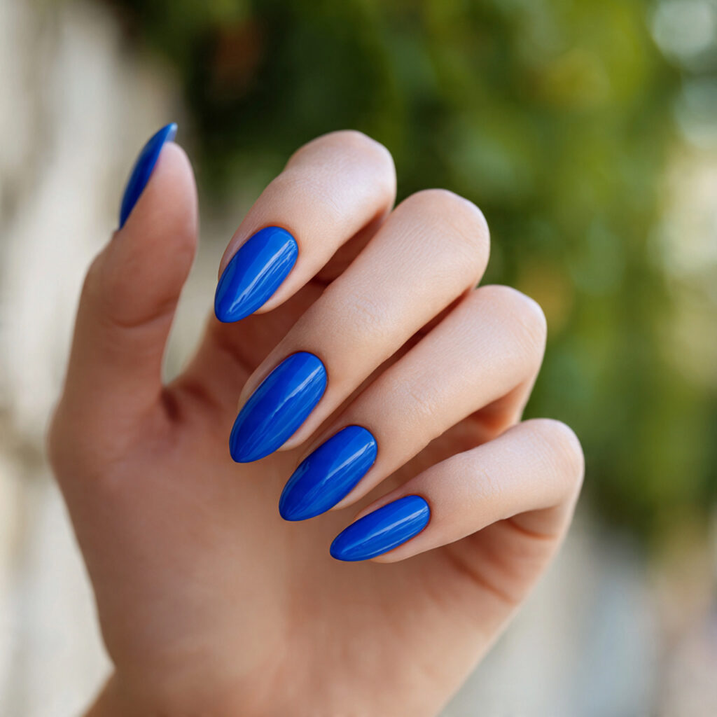 Summer Nails Bright: Bold Colors You’ll Fall in Love With 3 close up of one hand with attractive electric blue