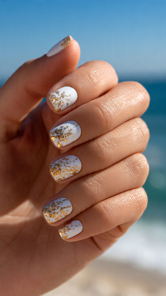 Summer Nails Beach: Ocean-Inspired Looks You’ll Want All Season 7 close up of one hand with attractive white and gol
