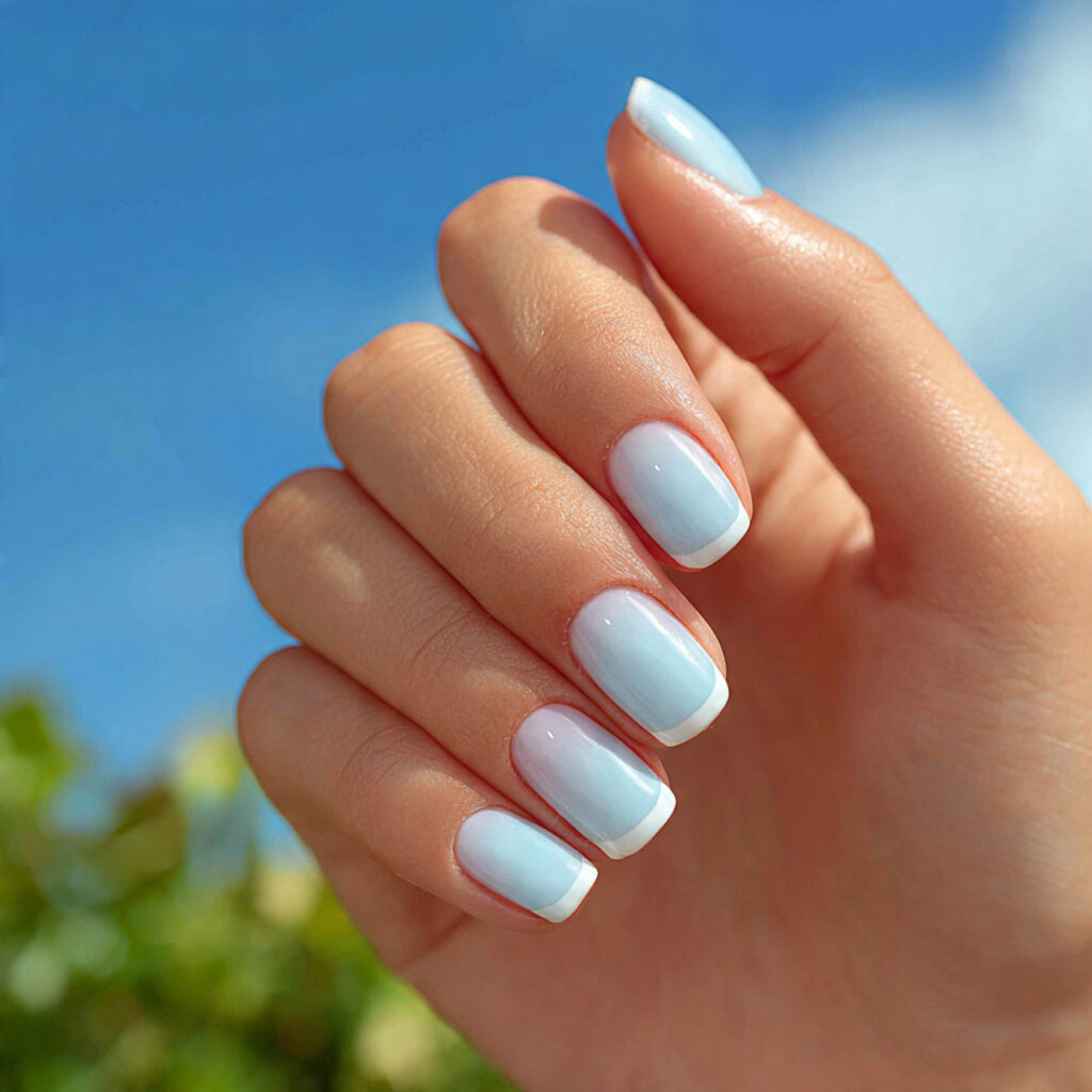 Summer Nails 2026 Blue: Cool, Glossy & Ocean-Inspired Perfection 8 one attractive hand with pastel blue french tip na