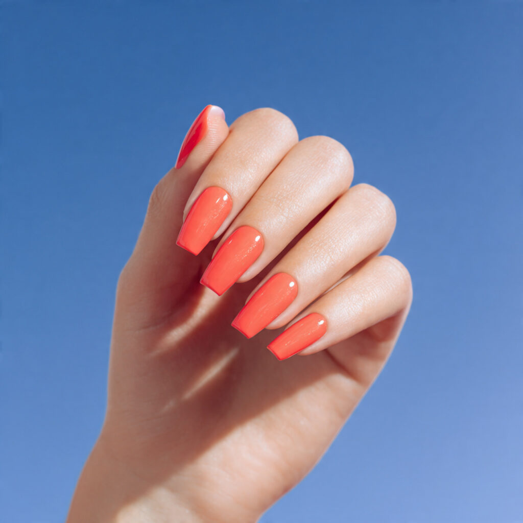 one hand with attractive coral summer long nails g