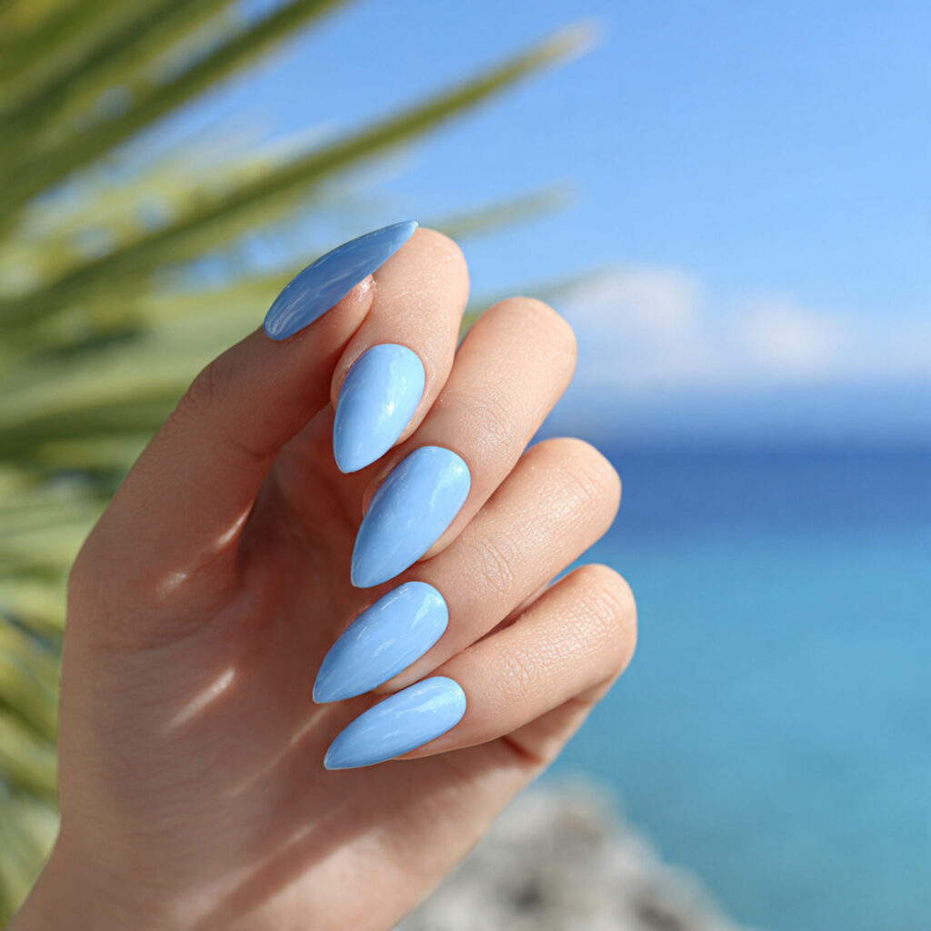 one hand with attractive ocean blue stiletto nails