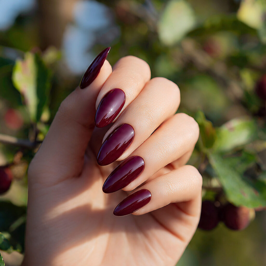 Almond Nails Red: 14 Dreamy, Classy & Bold Ideas You’ll Want to Save 3 a single attractive hand with deep burgundy almond