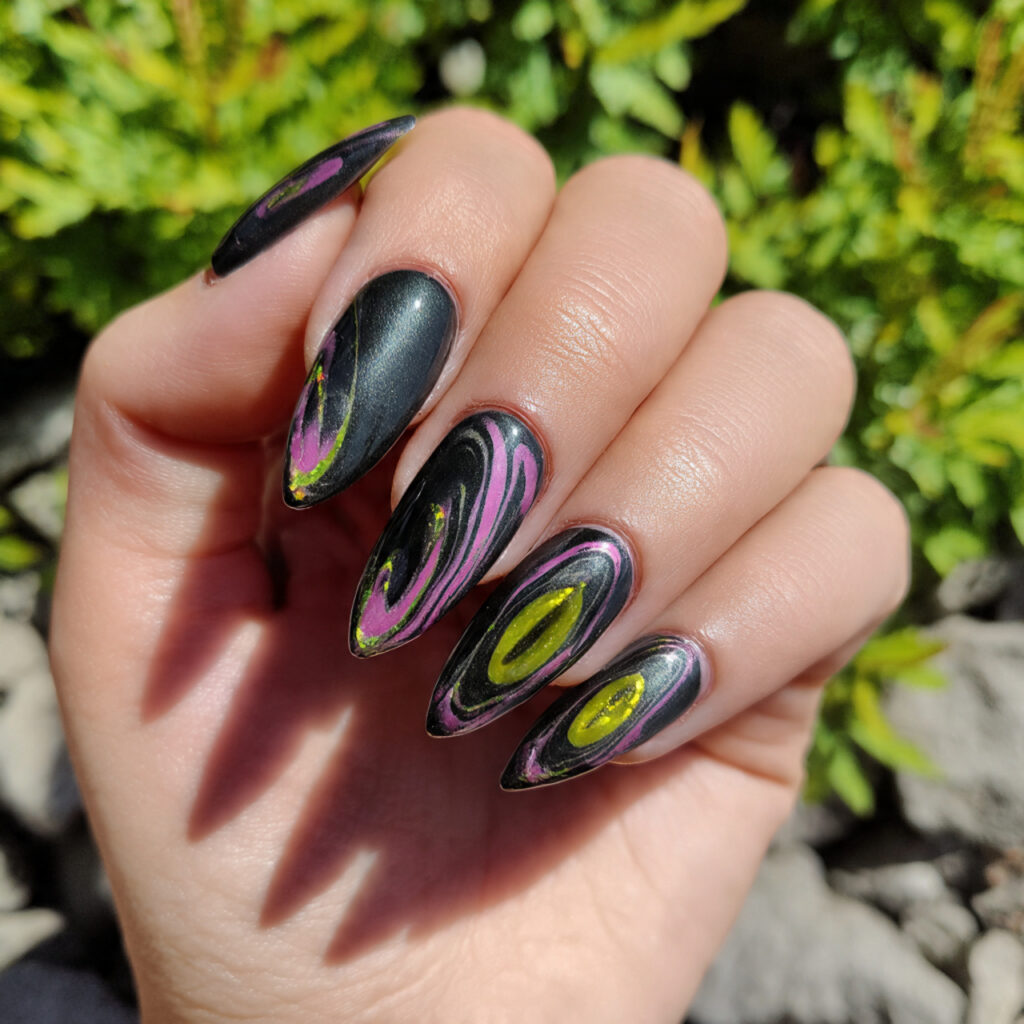 Nail Inspo Cat Eye: Magnetic Glow & Mesmerizing Shine 8 attractive cat eye swirl nails with outdoor backgr