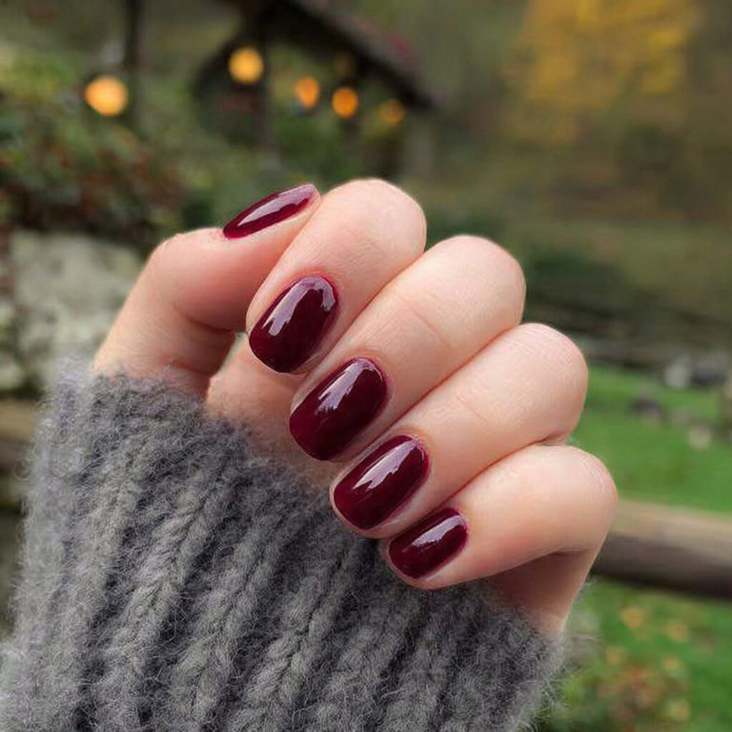 Short Nails Fall: Cozy, Chic & Cute Ideas You’ll Want to Save 3 attractive deep burgundy short nails with outdoor