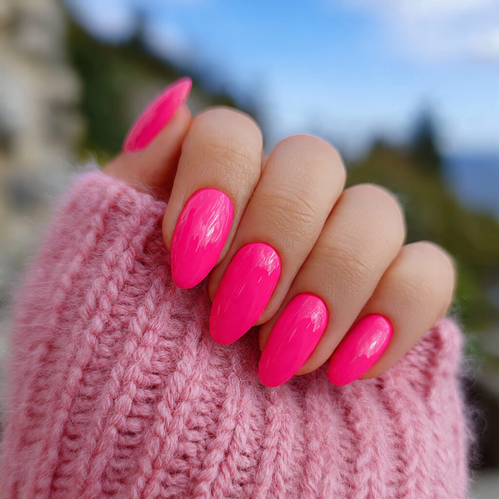 attractive hot pink candy nails with outdoor backg