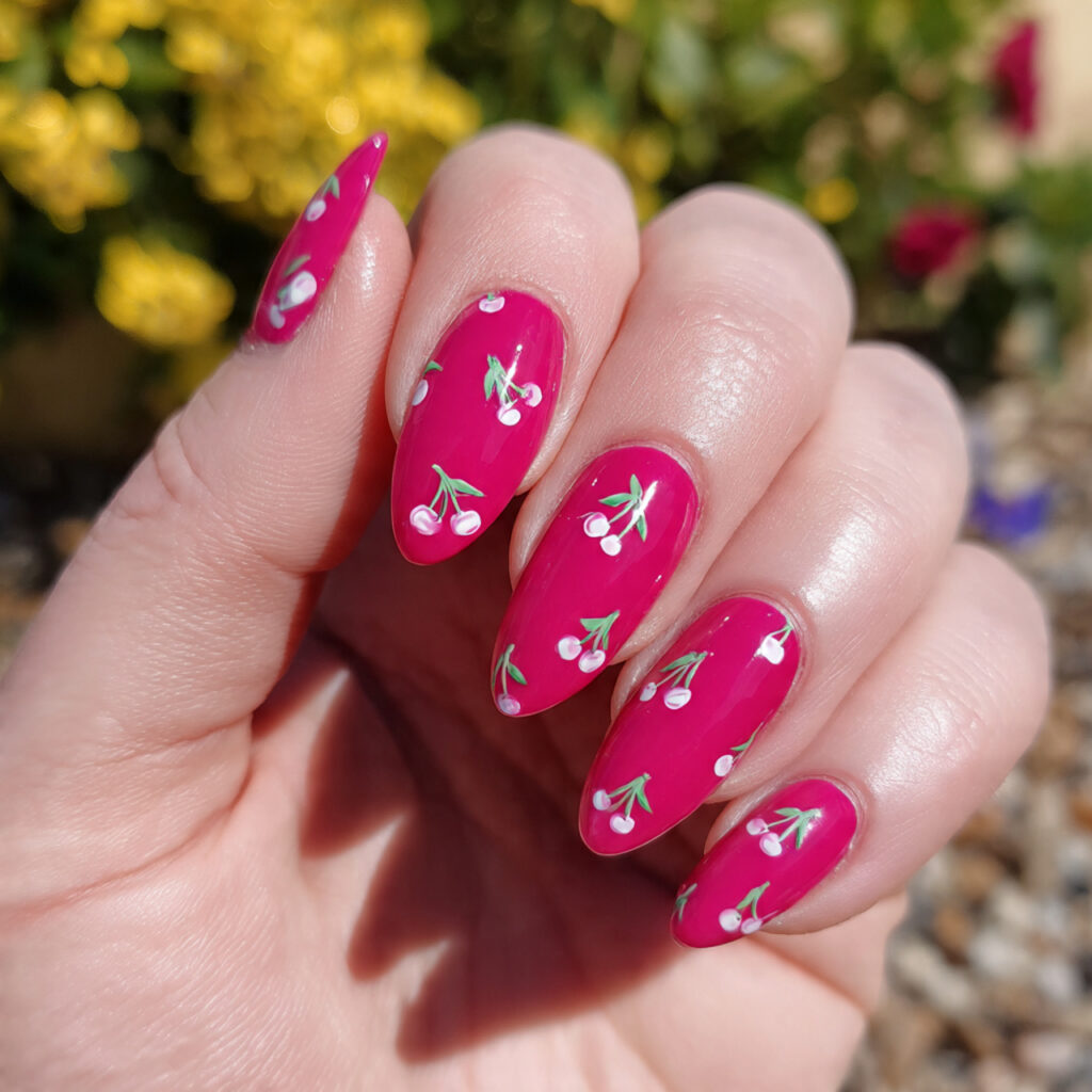attractive hot pink cherry accent nails with outdo