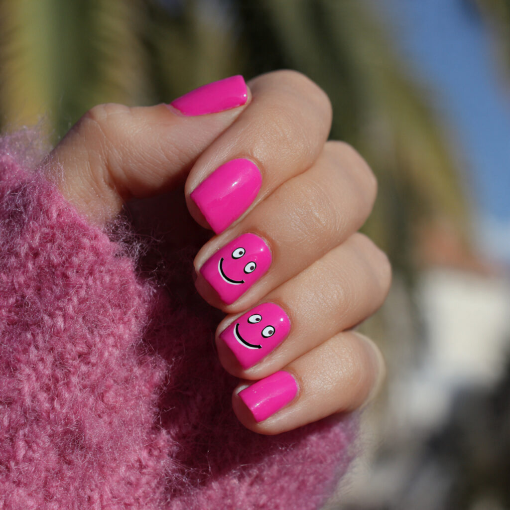 attractive hot pink smiley nails with outdoor back