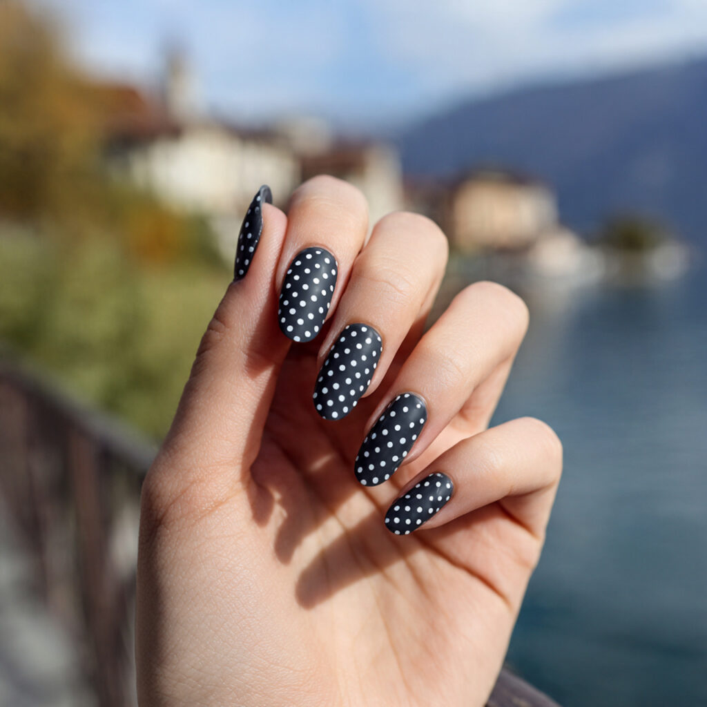 attractive minimal dark dot nails with outdoor bac