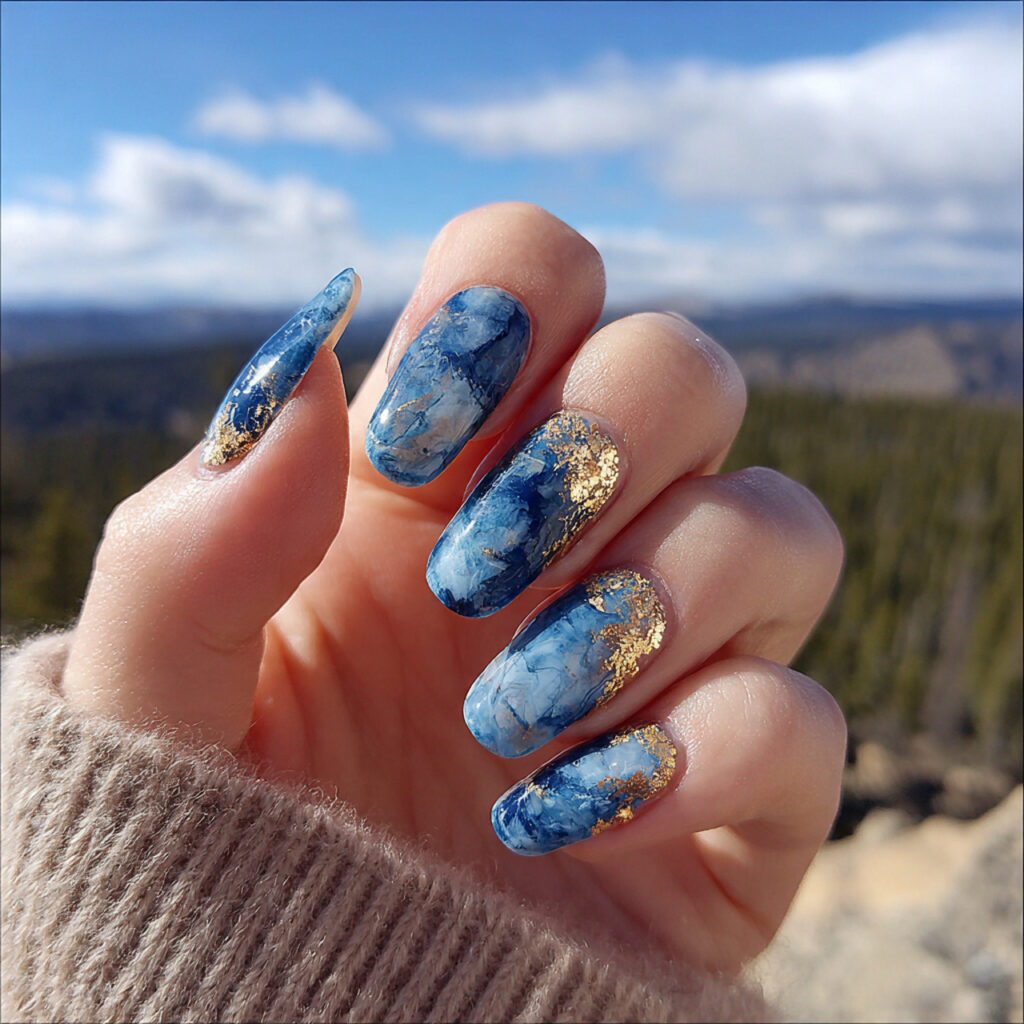 Nail Inspo Navy Blue: 14 Chic & Dreamy Designs You’ll Love 5 attractive navy blue marble nails with outdoor bac