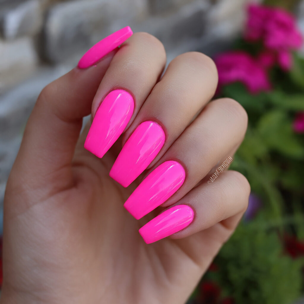Barbie Pink Nails: The Ultimate Girly Glow-Up 10 attractive neon barbie pink nails with outdoor bac