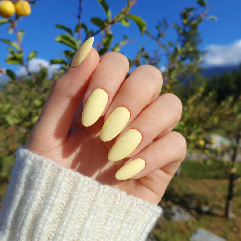 Nail Inspo Yellow: Bright, Happy & Sunshine-Ready 2 attractive pale yellow gloss nails with outdoor ba