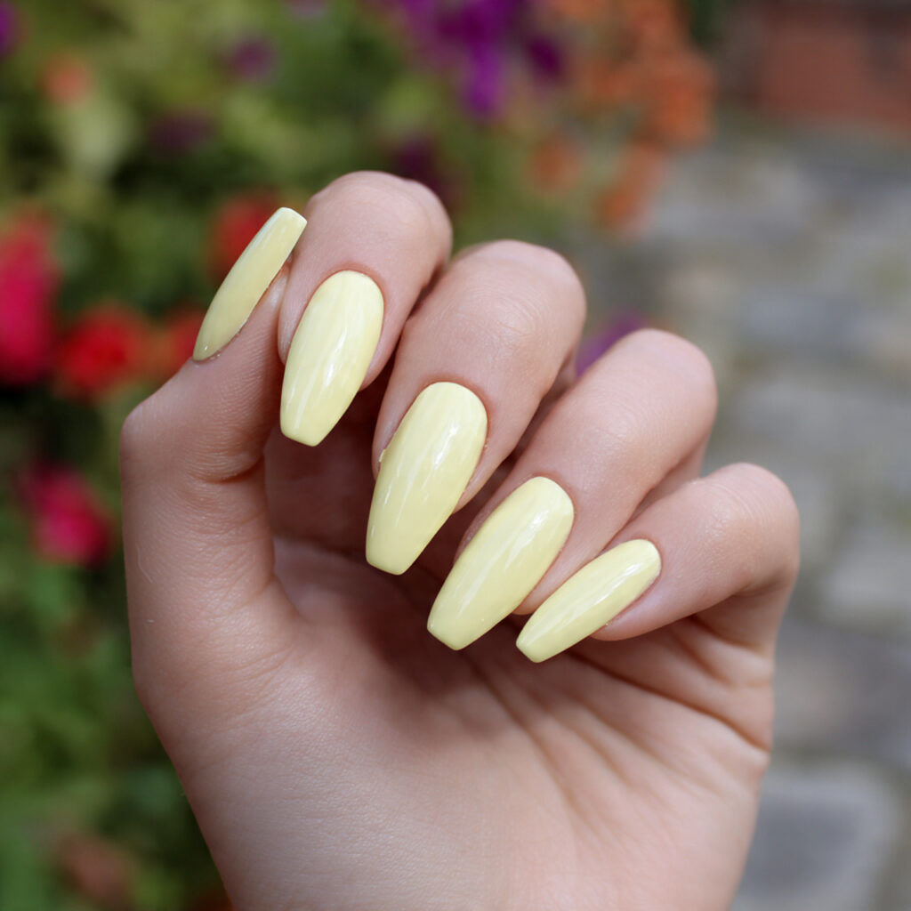 Short Coffin Nails Designs: Chic, Cute & Totally Addictive Ideas 6 attractive pastel yellow coffin nails with outdoor