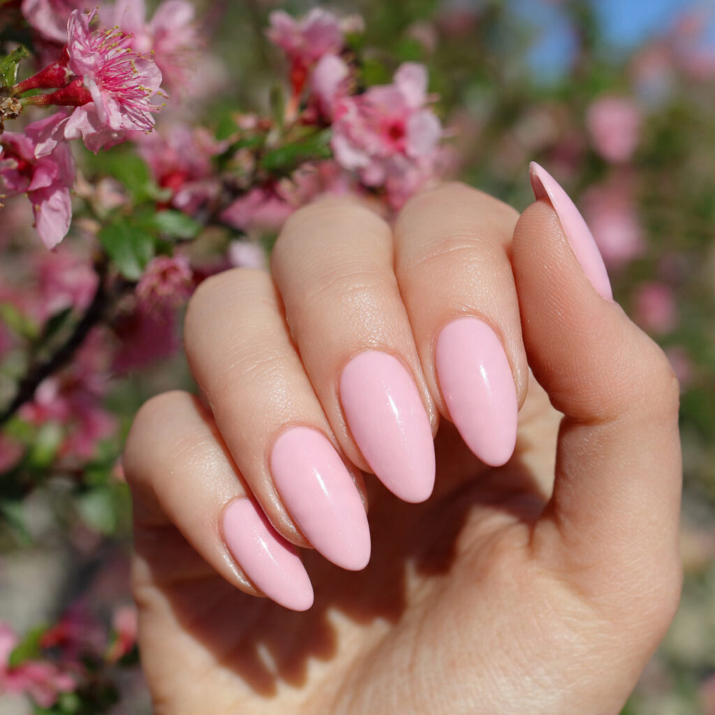 attractive pink almond nails with outdoor backgrou 1