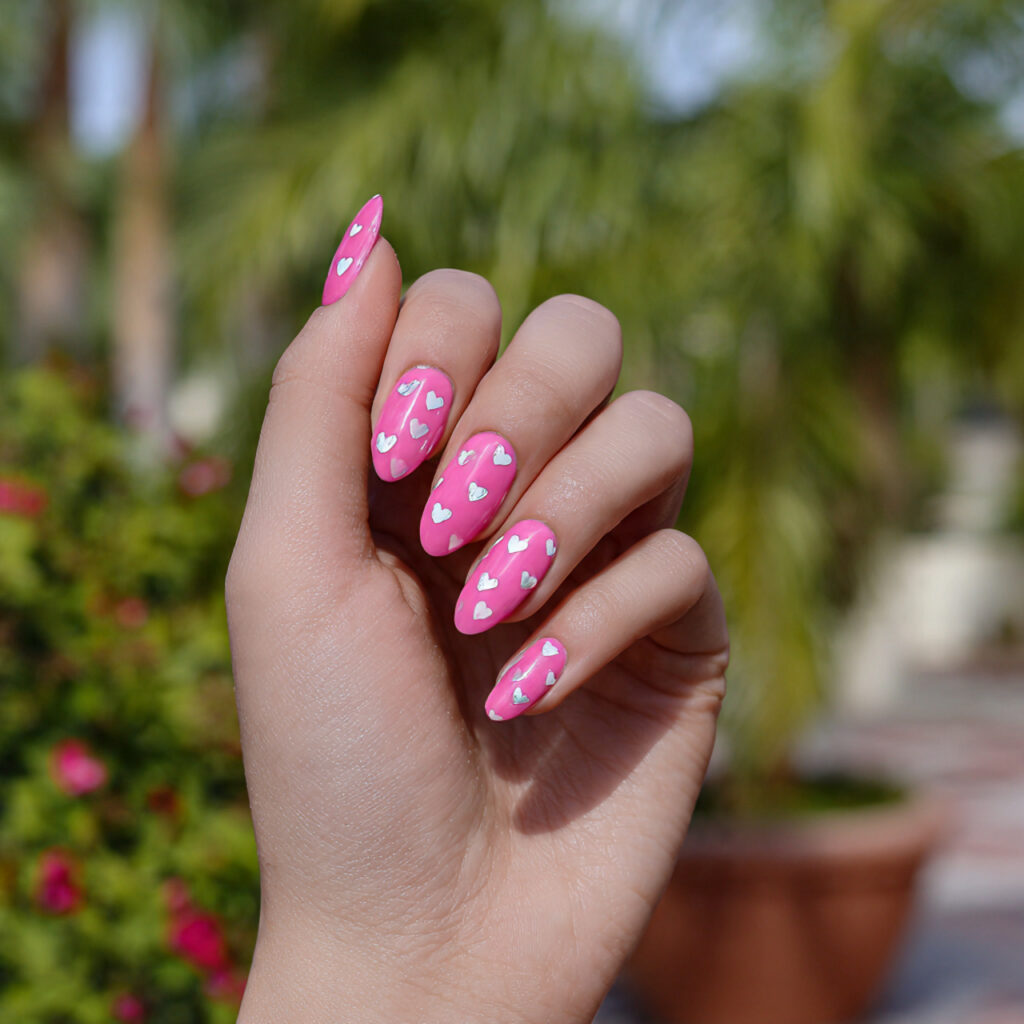 Nail Inspo Baddie: Bold, Glossy Looks That Own the Room 7 attractive pink baddie nails with hearts with outd
