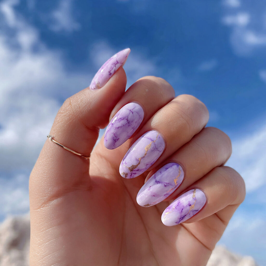 Nail Inspo Purple: 14 Dreamy & Trendy Designs You’ll Love 7 attractive soft purple marble nails with outdoor b