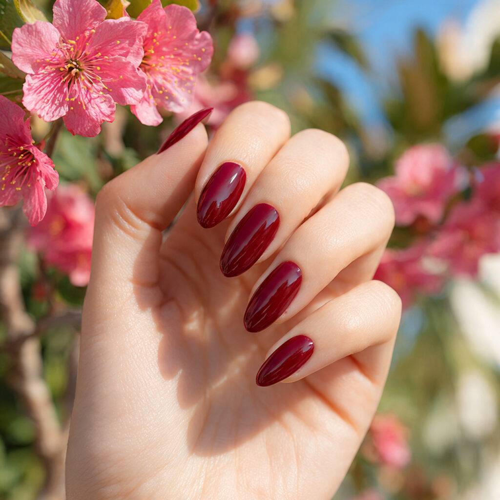 close up of one hand with attractive cherry red ch