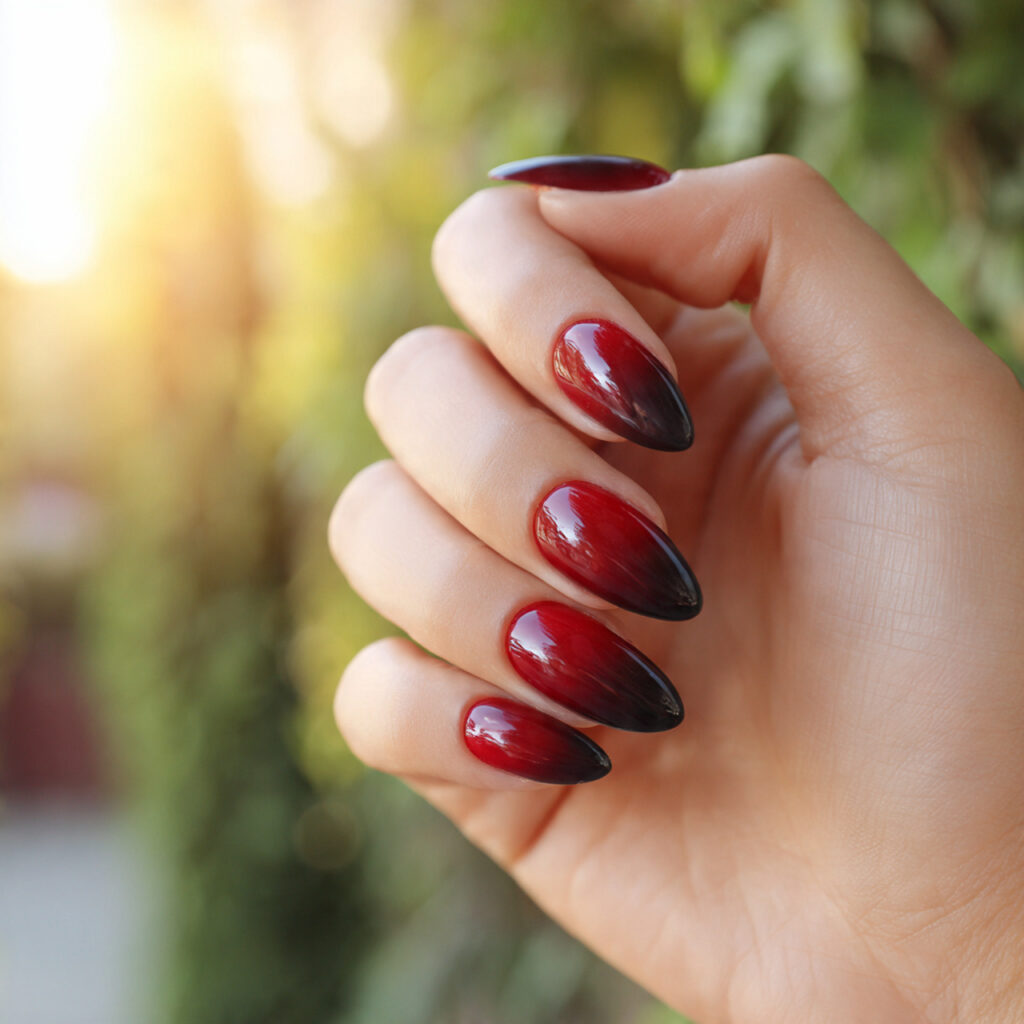 Almond Nails Red: 14 Dreamy, Classy & Bold Ideas You’ll Want to Save 12 close up of one hand with attractive red to black