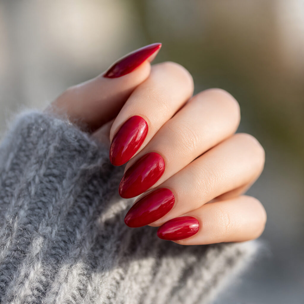 Red Nails Design Ideas Classy Almond: 14 Elegant Looks You’ll Love 1 one hand with glossy classic red almond shaped nai